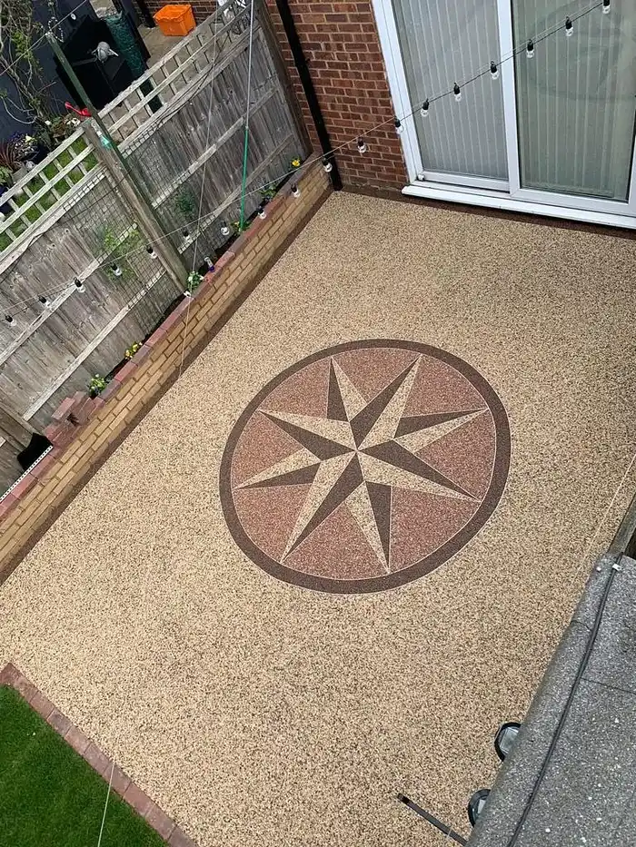 Gold resin patio with a compass star centrepiece